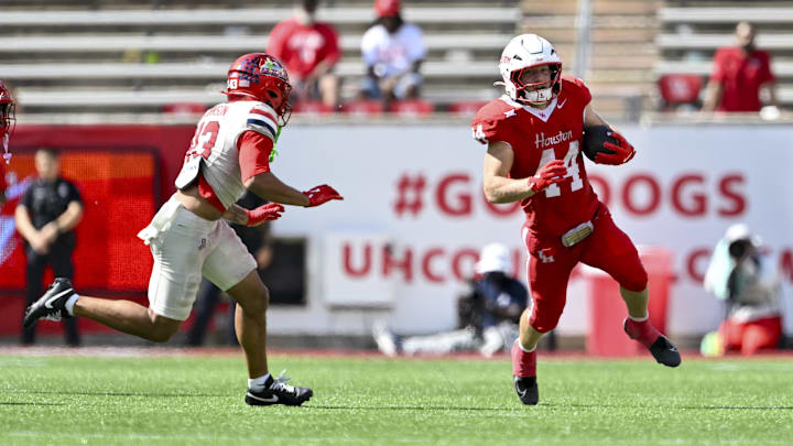 Oct 18, 2025; Houston, Texas, USA; Houston Cougars running back Dean Connors (44) runs the ball during the fourth quarter against the Arizona Wildcats at TDECU Stadium. Mandatory Credit: Maria Lysaker-Imagn Images  Oct 18, 2025; Houston, Texas, USA; Houston Cougars running back Dean Connors (44) runs the ball during the fourth quarter against the Arizona Wildcats at TDECU Stadium. Mandatory Credit: Maria Lysaker-Imagn Images