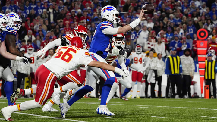 Nov 17, 2024; Orchard Park, New York, USA; Buffalo Bills quarterback Josh Allen (17) throws the ball against Kansas City Chiefs defensive end George Karlaftis (56) during the first half at Highmark Stadium. Mandatory Credit: Gregory Fisher-Imagn Images