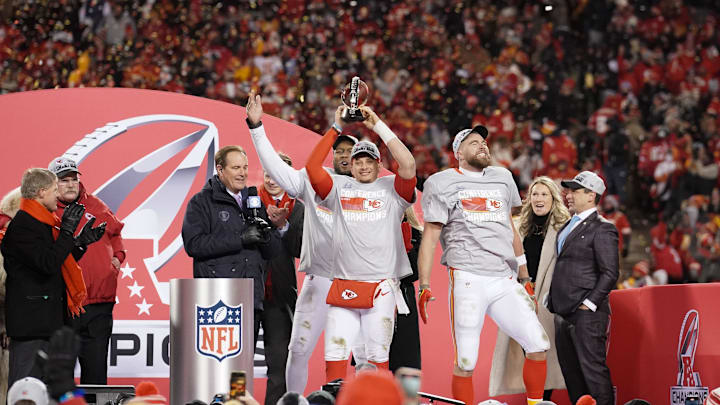 Jan 29, 2023; Kansas City, Missouri, USA; Kansas City Chiefs head coach Andy Reid and Clark Hunt and defensive end Carlos Dunlap (8) and tight end Travis Kelce (87) and quarterback Patrick Mahomes (15) and general manager Brett Veatch celebrate after winning the AFC Championship game against the Cincinnati Bengals at GEHA Field at Arrowhead Stadium. Mandatory Credit: Denny Medley-USA TODAY Sports