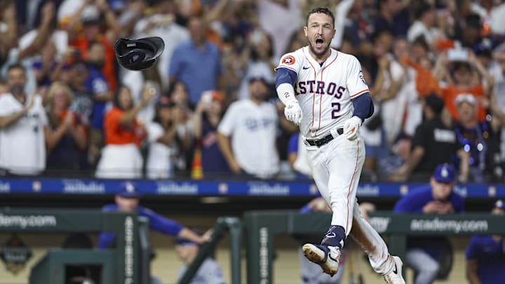 Jul 27, 2024; Houston, Texas, USA; Houston Astros third baseman Alex Bregman (2) throws his helmet after hitting a walk-off home run during the ninth inning against the Los Angeles Dodgers at Minute Maid Park.