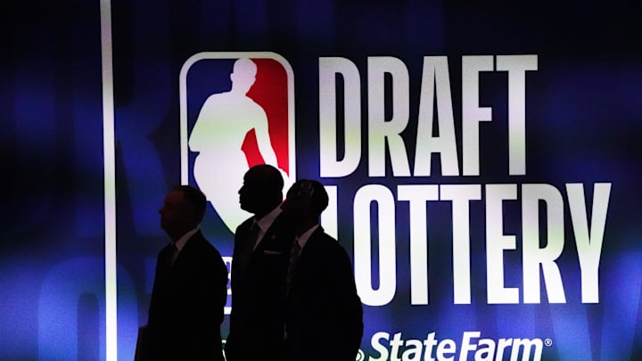 May 16, 2023; Chicago, IL, USA; People walk past the 2023 NBA Draft Lottery board at McCormick Place West. Mandatory Credit: David Banks-Imagn Images