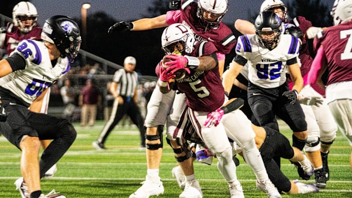 Dowling Catholic’s Ian Middleton (5) reaches across the goal line for a touchdown on Oct. 10, 2025, at Valley Stadium in West Des Moines.