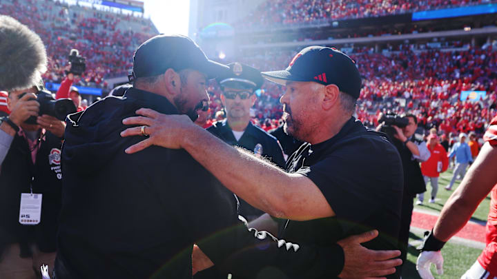 Oct 26, 2024; Columbus, Ohio, USA; Ohio State Buckeyes head coach Ryan Day and Nebraska Cornhuskers head coach Matt Rhule meet at midfield after the game at Ohio Stadium. Mandatory Credit: Joseph Maiorana-Imagn Images