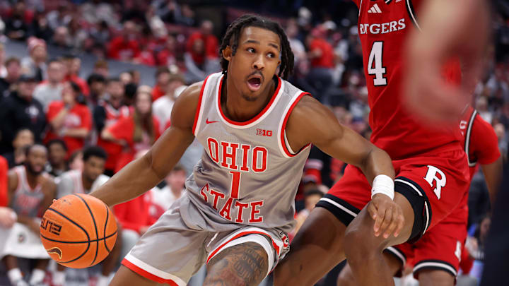 Dec 7, 2024; Columbus, Ohio, USA;  Ohio State Buckeyes guard Meechie Johnson Jr. (1) controls the ball as Rutgers Scarlet Knights guard Ace Bailey (4) defends during the second half at Value City Arena. Mandatory Credit: Joseph Maiorana-Imagn Images