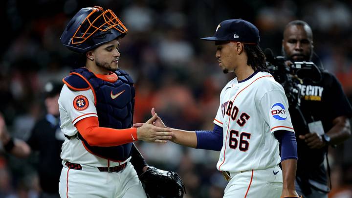 Jul 1, 2026; Houston, Texas, USA; Houston Astros pitcher Miguel Ullola (66) is greeted by catcher Yainer Diaz (21) after retiring the side against the Minnesota Twins during the sixth inning at Daikin Park. Mandatory Credit: Erik Williams-Imagn Images