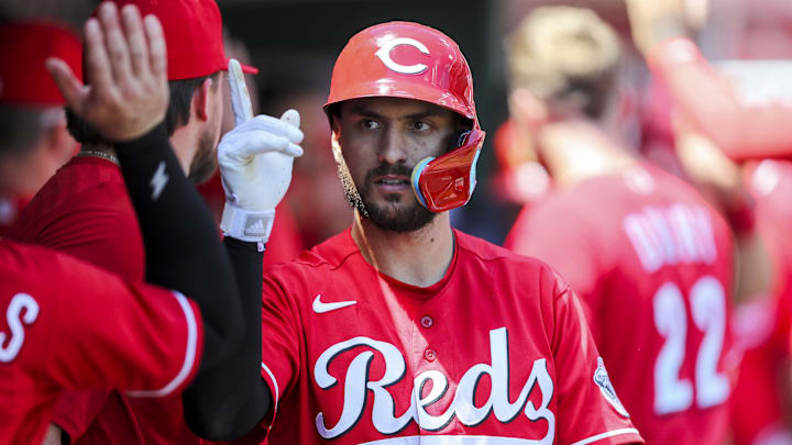 Cincinnati Reds left fielder Albert Almora Jr. (3) high fives his teammates.