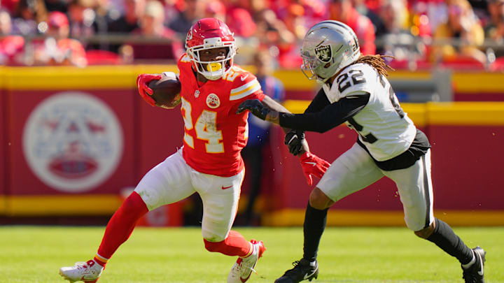 Oct 19, 2025; Kansas City, Missouri, USA; Kansas City Chiefs running back Brashard Smith (24) carries the ball defended by Las Vegas Raiders cornerback Eric Stokes (22) during the fourth quarter of the game at GEHA Field at Arrowhead Stadium. Mandatory Credit: Jay Biggerstaff-Imagn Images Oct 19, 2025; Kansas City, Missouri, USA; Kansas City Chiefs running back Brashard Smith (24) carries the ball defended by Las Vegas Raiders cornerback Eric Stokes (22) during the fourth quarter of the game at GEHA Field at Arrowhead Stadium. Mandatory Credit: Jay Biggerstaff-Imagn Images