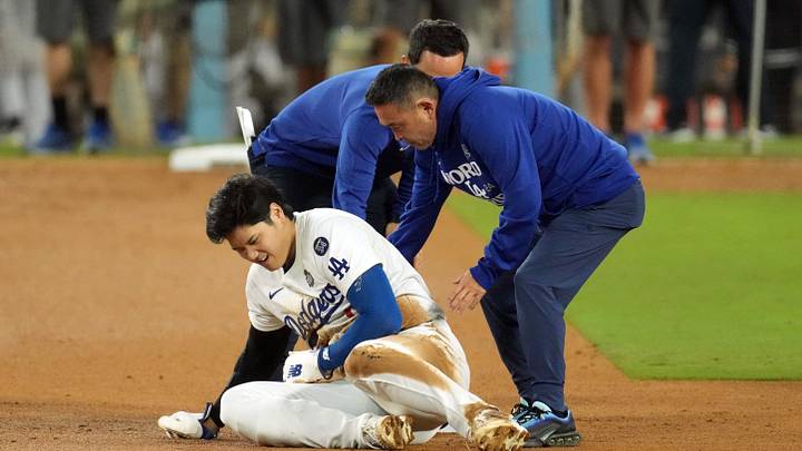 Oct 26, 2024; Los Angeles, California, USA; Los Angeles Dodgers designated hitter Shohei Ohtani (17) reacts at second base after an apparent injury in the seventh inning against the New York Yankees during game two of the 2024 MLB World Series at Dodger Stadium. Mandatory Credit: Kirby Lee-Imagn Images