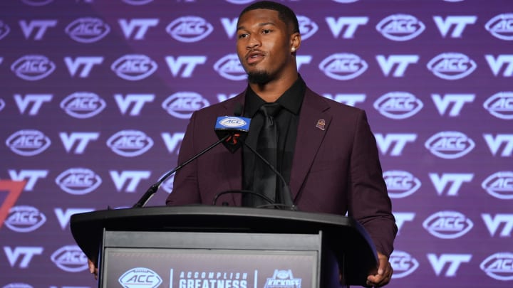 Jul 23, 2024; Charlotte, NC, USA; Virginia Tech quarterback Kyron Drones answers questions from the media during the ACC Kickoff at Hilton Charlotte Uptown. Mandatory Credit: Jim Dedmon-USA TODAY Sports Jul 23, 2024; Charlotte, NC, USA; Virginia Tech quarterback Kyron Drones answers questions from the media during the ACC Kickoff at Hilton Charlotte Uptown. Mandatory Credit: Jim Dedmon-USA TODAY Sports
