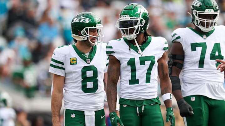 Dec 15, 2024; Jacksonville, Florida, USA; New York Jets quarterback Aaron Rodgers (8) and wide receiver Davante Adams (17) was out to the field after a turnover against the Jacksonville Jaguars in the first quarter at EverBank Stadium. Mandatory Credit: Nathan Ray Seebeck-Imagn Images Dec 15, 2024; Jacksonville, Florida, USA; New York Jets quarterback Aaron Rodgers (8) and wide receiver Davante Adams (17) was out to the field after a turnover against the Jacksonville Jaguars in the first quarter at EverBank Stadium. Mandatory Credit: Nathan Ray Seebeck-Imagn Images