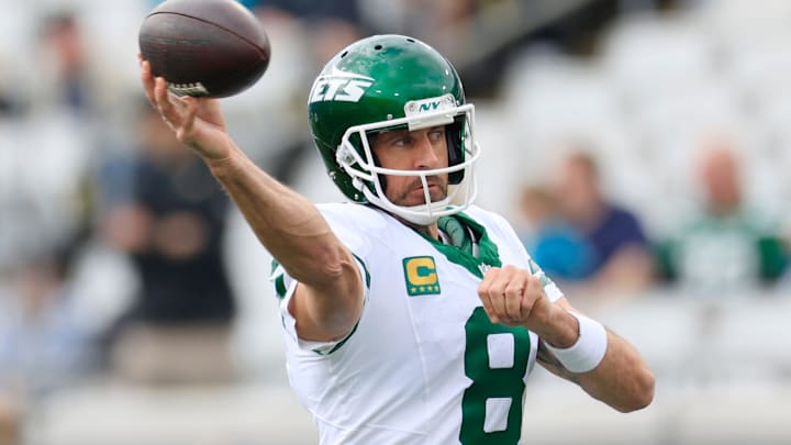 New York Jets quarterback Aaron Rodgers (8) warms up before an NFL football matchup Sunday, Dec. 15, 2024 at EverBank Stadium in Jacksonville, Fla. [Corey Perrine/Florida Times-Union]