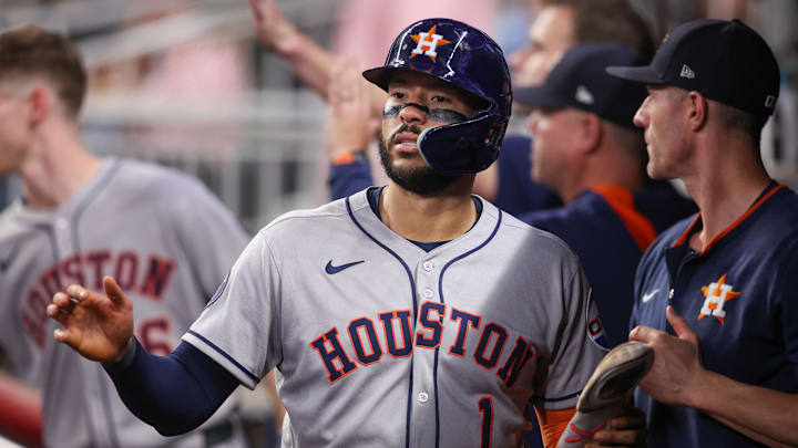 Houston Astros third baseman Carlos Correa (1) celebrates with teammates after scoring a run against the Atlanta Braves in the fifth inning at Truist Park. Houston Astros third baseman Carlos Correa (1) celebrates with teammates after scoring a run against the Atlanta Braves in the fifth inning at Truist Park.