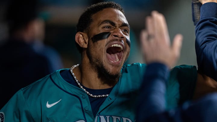 Seattle Mariners center fielder Julio Rodriguez celebrates after scoring a run against the Oakland Athletics on Sept. 28 at T-Mobile Park.. Seattle Mariners center fielder Julio Rodriguez celebrates after scoring a run against the Oakland Athletics on Sept. 28 at T-Mobile Park..