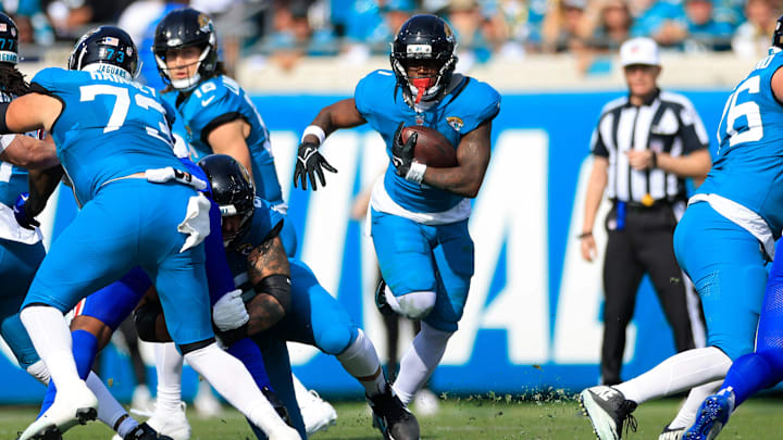 Jacksonville Jaguars running back Travis Etienne Jr. (1) rushes for yards during the first quarter of an NFL football AFC Wild Card playoff matchup, Sunday, Jan. 11, 2026, in Jacksonville, Fla. The Bills defeated the Jaguars 27-24. [Corey Perrine/Florida Times-Union]