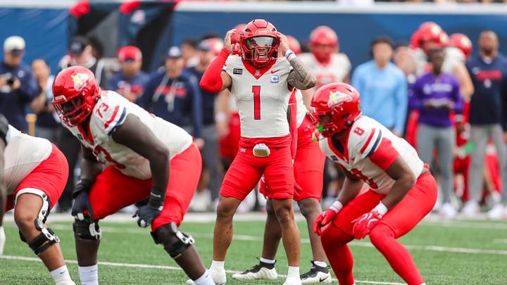 Oct 10, 2026; Morgantown, West Virginia, USA; Arizona Wildcats quarterback Noah Fifita (1) changes a play at the line of scrimmage during the first quarter against the West Virginia Mountaineers at Milan Puskar Stadium.
