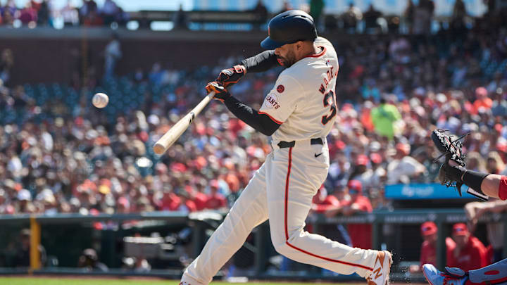 Sep 28, 2024; San Francisco, California, USA; San Francisco Giants infielder LaMonte Wade Jr. (31) hits an RBI single against the St. Louis Cardinals during the first inning at Oracle Park. 
