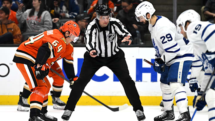 Mar 30, 2026; Anaheim, California, USA; Anaheim Ducks center Mikael Granlund (64), linesman Ryan Gibbons (58) and Toronto Maple Leafs center Bo Groulx (29) during a face off during the second period at Honda Center. Mandatory Credit: Griffin Hooper-Imagn Images Mar 30, 2026; Anaheim, California, USA; Anaheim Ducks center Mikael Granlund (64), linesman Ryan Gibbons (58) and Toronto Maple Leafs center Bo Groulx (29) during a face off during the second period at Honda Center. Mandatory Credit: Griffin Hooper-Imagn Images