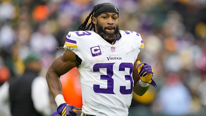 Nov 23, 2025; Green Bay, Wisconsin, USA;  Minnesota Vikings running back Aaron Jones Sr. (33) during the game against the Green Bay Packers at Lambeau Field.
