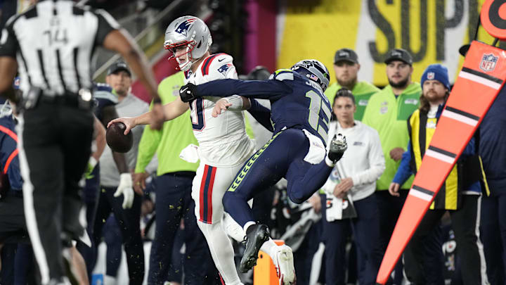 Feb 8, 2026; Santa Clara, CA, USA; Seattle Seahawks linebacker Ernest Jones IV (13) tackles New England Patriots quarterback Drake Maye (10) during the third quarter in Super Bowl LX at Levi's Stadium. Mandatory Credit: Kyle Terada-Imagn Images