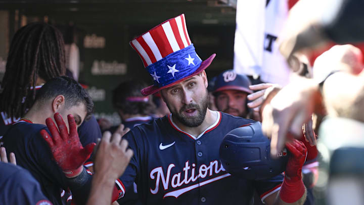 Sep 21, 2024; Chicago, Illinois, USA;  Washington Nationals first baseman Joey Gallo (24) celebrates in the dugout after he hits a three run home run against the Chicago Cubs during the sixth inning at Wrigley Field. 