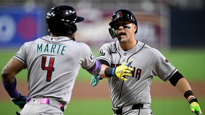 Sep 25, 2026; San Diego, California, USA;  Arizona Diamondbacks left fielder Lars Nootbaar (21) is congratulated by second baseman Ketel Marte (4) after hitting a solo home run during the first inning against the San Diego Padres at Petco Park.  Mandatory Credit: Denis Poroy-Imagn Images