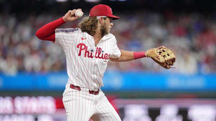 Aug 30, 2025; Philadelphia, Pennsylvania, USA; Philadelphia Phillies infielder Alec Bohm (28) throws to first against the Atlanta Braves in the seventh inning at Citizens Bank Park. Mandatory Credit: Kyle Ross-Imagn Images