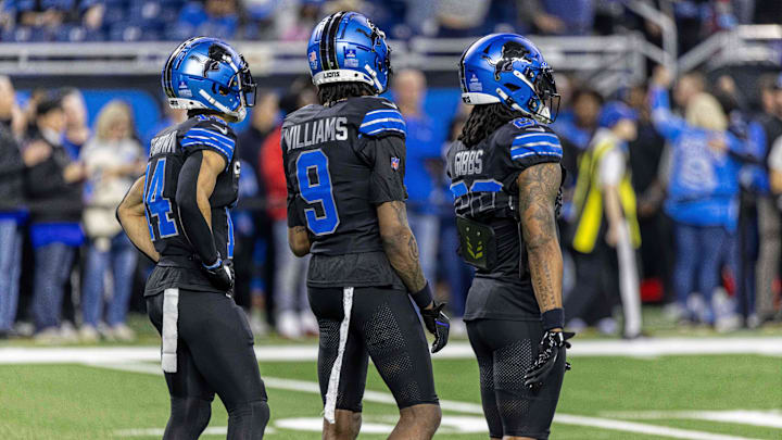 Detroit Lions wide receiver Amon-Ra St. Brown (14), wide receiver Jameson Williams (9) and running back Jahmyr Gibbs (26).