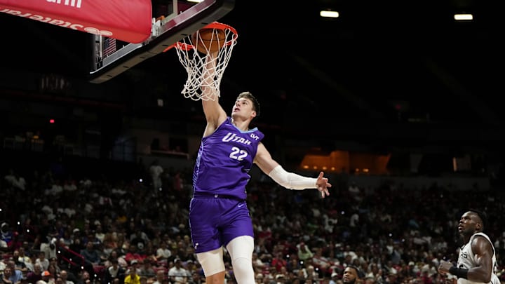 Jul 14, 2025; Las Vegas, NV, USA;  Utah Jazz forward Kyle Filipowski (22) dunks the ball against the San Antonio Spurs during the first half of a NBA basketball game at the Thomas & Mack Center. Mandatory Credit: Lucas Peltier-Imagn Images
