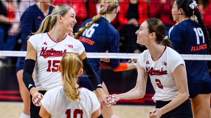 Andi Jackson (15) smiles at Bergen Reilly (2) after scoring a point. 