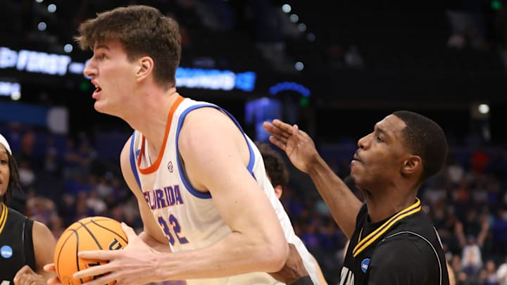 Florida center Olivier Rioux (32) rebounds during second half of NCAA March Madness opening round at Benchmark international Arena in Tampa, FL on Friday, March 20, 2026. Florida won 114-55.[Alan Youngblood/Gainesville Sun]
