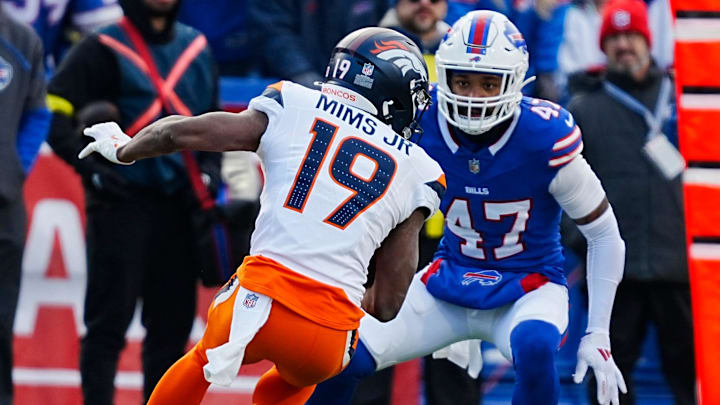 Buffalo Bills cornerback Christian Benford (47) gets ready to tackle Denver Broncos wide receiver Marvin Mims Jr. (19) who was heading towards him during the second half of the Buffalo Bills wild card game against the Denver Broncos at Highmark Stadium in Orchard Park on Jan. 12, 2025. Buffalo Bills cornerback Christian Benford (47) gets ready to tackle Denver Broncos wide receiver Marvin Mims Jr. (19) who was heading towards him during the second half of the Buffalo Bills wild card game against the Denver Broncos at Highmark Stadium in Orchard Park on Jan. 12, 2025.