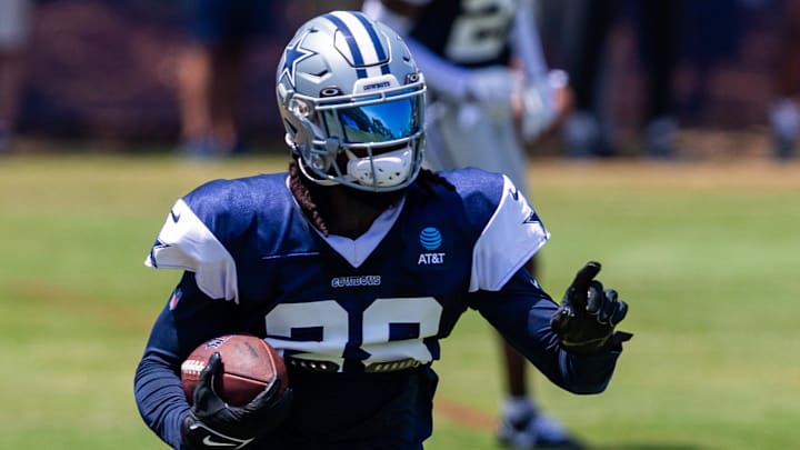 Dallas Cowboys safety Malik Hooker returns an interception during training camp in Oxnard, California. 