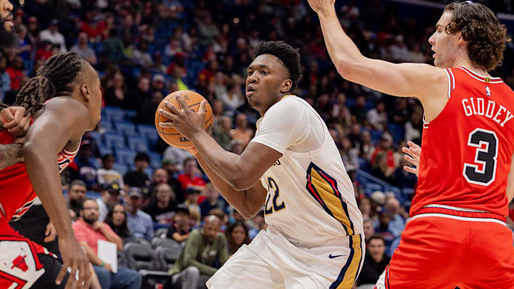 Nov 24, 2025; New Orleans, Louisiana, USA;  New Orleans Pelicans center Derik Queen (22) drives to the basket against Chicago Bulls guard Josh Giddey (3) during the first half at Smoothie King Center. Mandatory Credit: Stephen Lew-Imagn Images