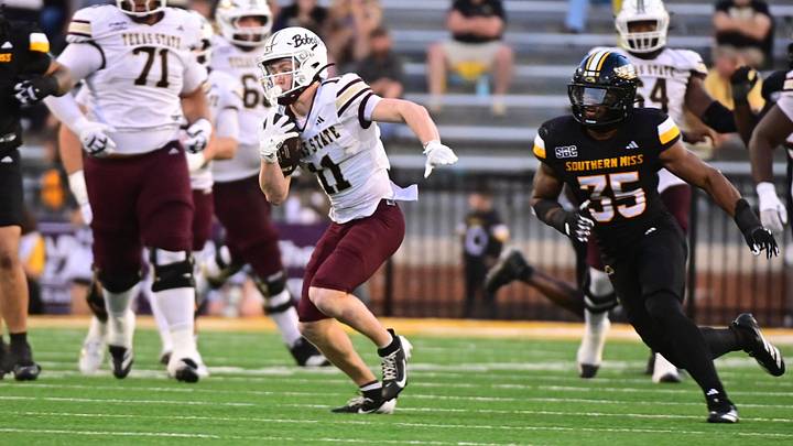 Texas State Bobcats wide receiver Beau Sparks runs the ball while defended by Southern Miss Golden Eagles linebacker Chris Jones Texas State Bobcats wide receiver Beau Sparks runs the ball while defended by Southern Miss Golden Eagles linebacker Chris Jones
