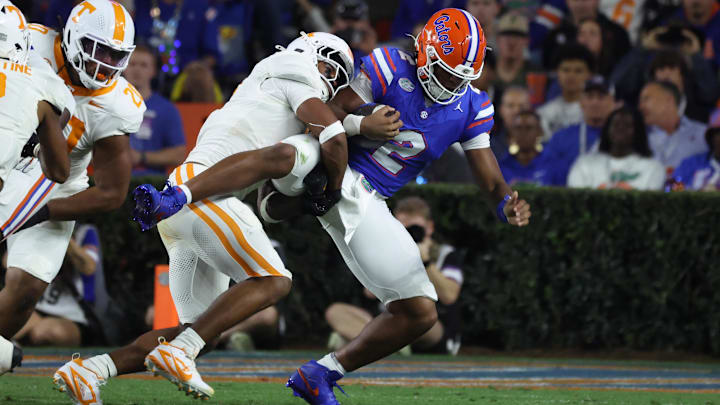 Nov 22, 2025; Gainesville, Florida, USA; Florida Gators quarterback DJ Lagway (2) is tackled by Tennessee Volunteers linebacker Arion Carter (7) during the first half at Ben Hill Griffin Stadium. Mandatory Credit: Kim Klement Neitzel-Imagn Images Nov 22, 2025; Gainesville, Florida, USA; Florida Gators quarterback DJ Lagway (2) is tackled by Tennessee Volunteers linebacker Arion Carter (7) during the first half at Ben Hill Griffin Stadium. Mandatory Credit: Kim Klement Neitzel-Imagn Images