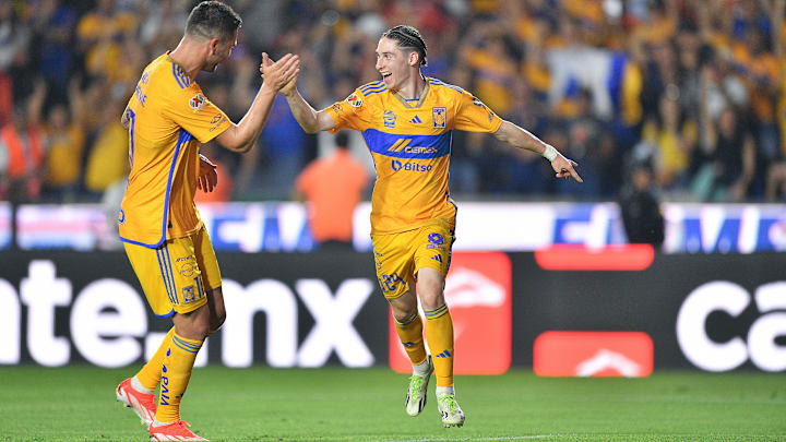 André-Pierre Gignac (left) congratulates Marcelo Flores after the youngster scored a hat trick to lead Tigres past Necaxa in a key Liga MX contest Saturday night.