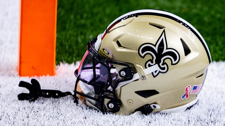 Sep 8, 2024; New Orleans, Louisiana, USA;  Detailed view of the New Orleans Saints football helmet before the game against the Carolina Panthers during the pregame at Caesars Superdome. Mandatory Credit: Stephen Lew-Imagn Images