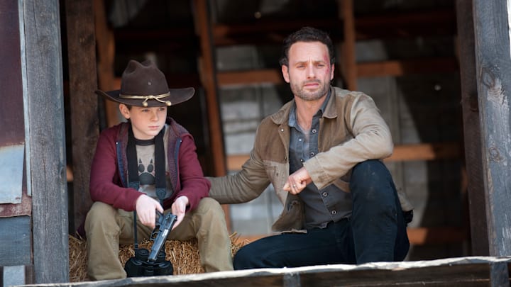 Carl Grimes (Chandler Riggs) and Rick Grimes (Andrew Lincoln) - The Walking Dead - Season 2, Episode 12 - Photo Credit: Gene Page/AMC