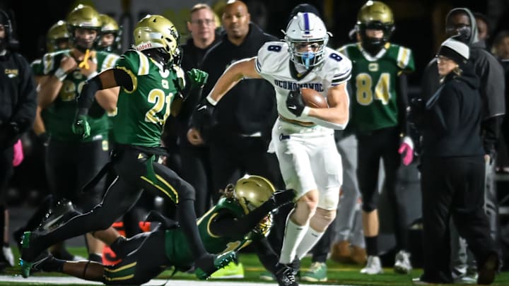 Oconomowoc tight end Emmett Bork (8) works for yardage after a catch against Racine Case in a Division 1 first-round playoff game Friday, October 25, 2024, at Hammes Field in Racine, Wisconsin. Oconomowoc tight end Emmett Bork (8) works for yardage after a catch against Racine Case in a Division 1 first-round playoff game Friday, October 25, 2024, at Hammes Field in Racine, Wisconsin.