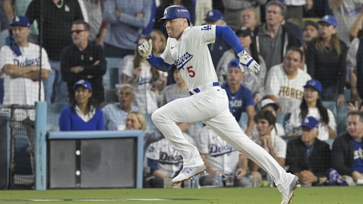 Los Angeles Dodgers first baseman Freddie Freeman runs out a single in Game 1 of a National League Divisional Series against the San Diego Padres on Saturday at Dodger Stadium.