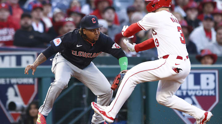 May 24, 2024; Anaheim, California, USA; Cleveland Guardians third base José Ramírez (11) tags out Los Angeles Angels outfielder Taylor Ward (3) during the third inning of a game at Angel Stadium. Mandatory Credit: Jessica Alcheh-Imagn Images