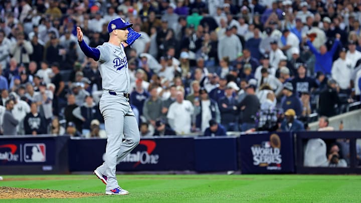Oct 30, 2024; New York, New York, USA; Los Angeles Dodgers pitcher Walker Buehler (21) celebrates after beating the New York Yankees in game four to win the 2024 MLB World Series at Yankee Stadium. Mandatory Credit: Brad Penner-Imagn Images