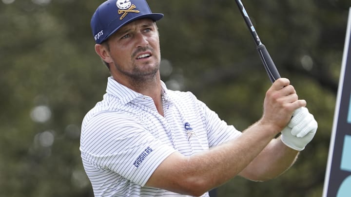 Bryson DeChambeau of the Crushers GC watches his shot from the tenth tee during the LIV Golf Dallas Team Championship. Bryson DeChambeau of the Crushers GC watches his shot from the tenth tee during the LIV Golf Dallas Team Championship.