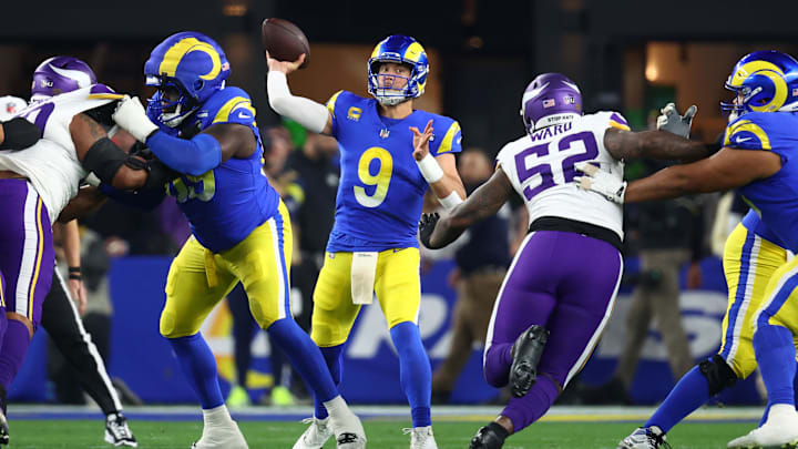 Jan 13, 2025; Glendale, AZ, USA; Los Angeles Rams quarterback Matthew Stafford (9) drops back to pass against the Minnesota Vikings during the first half in an NFC wild card game at State Farm Stadium. Mandatory Credit: Mark J. Rebilas-Imagn Images