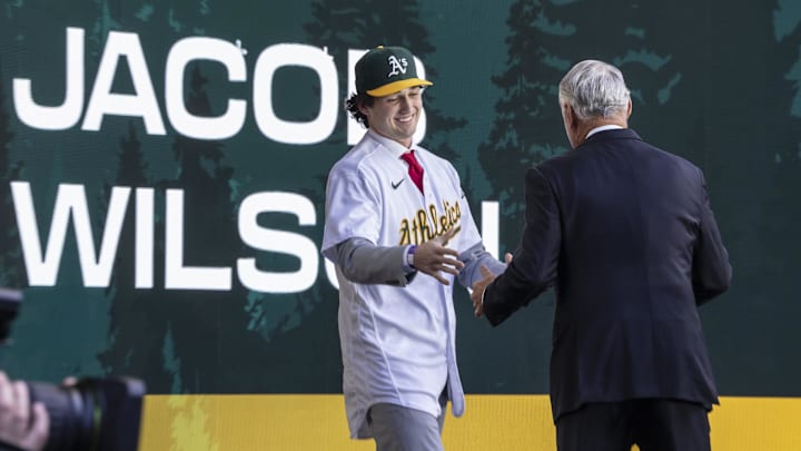 Jul 9, 2023; Seattle, Washington, USA; Oakland Athletics draft pick Jacob Wilson shakes hands with Rob Manfred during the first round of the MLB Draft at Lumen Field. Mandatory Credit: Stephen Brashear-Imagn Images Jul 9, 2023; Seattle, Washington, USA; Oakland Athletics draft pick Jacob Wilson shakes hands with Rob Manfred during the first round of the MLB Draft at Lumen Field. Mandatory Credit: Stephen Brashear-Imagn Images