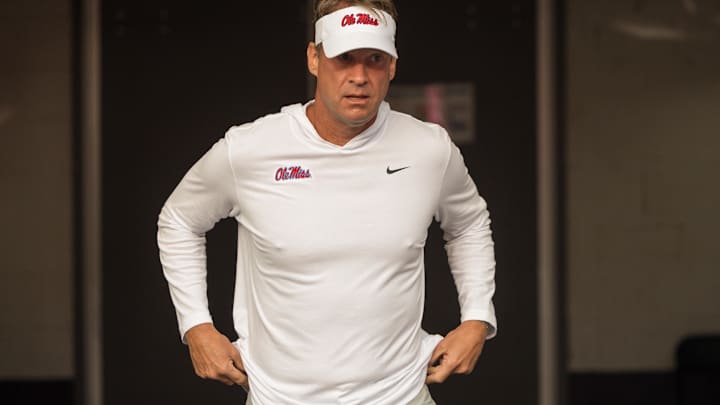 Mississippi Rebels head coach Lane Kiffin takes the field before a game against the LSU Tigers at Tiger Stadium.