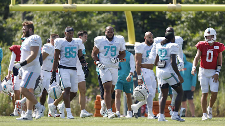 Former Bears tackle Larry Borom (79) walks on the field at Friday's joint training camp practice at Halas Hall.