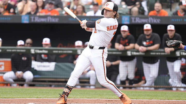May 4, 2025; Baltimore, Maryland, USA; Baltimore Orioles shortstop Gunnar Henderson (2) hits a double against the Kansas City Royals during the first inning at Oriole Park at Camden Yards.