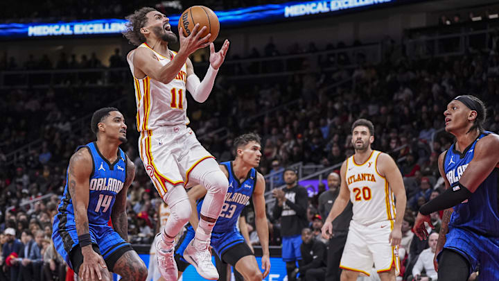 Feb 20, 2025; Atlanta, Georgia, USA; Atlanta Hawks guard Trae Young (11) goes to wards the basket behind Orlando Magic guard Gary Harris (14) during the second half at State Farm Arena. Mandatory Credit: Dale Zanine-Imagn Images Feb 20, 2025; Atlanta, Georgia, USA; Atlanta Hawks guard Trae Young (11) goes to wards the basket behind Orlando Magic guard Gary Harris (14) during the second half at State Farm Arena. Mandatory Credit: Dale Zanine-Imagn Images