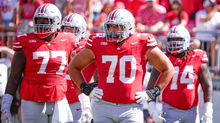 Sep 21, 2024; Columbus, Ohio, USA; Ohio State Buckeyes offensive lineman Tegra Tshabola (77), offensive lineman Josh Fryar (70) stand on the field in the second quarter at Ohio Stadium on Saturday. Sep 21, 2024; Columbus, Ohio, USA; Ohio State Buckeyes offensive lineman Tegra Tshabola (77), offensive lineman Josh Fryar (70) stand on the field in the second quarter at Ohio Stadium on Saturday.